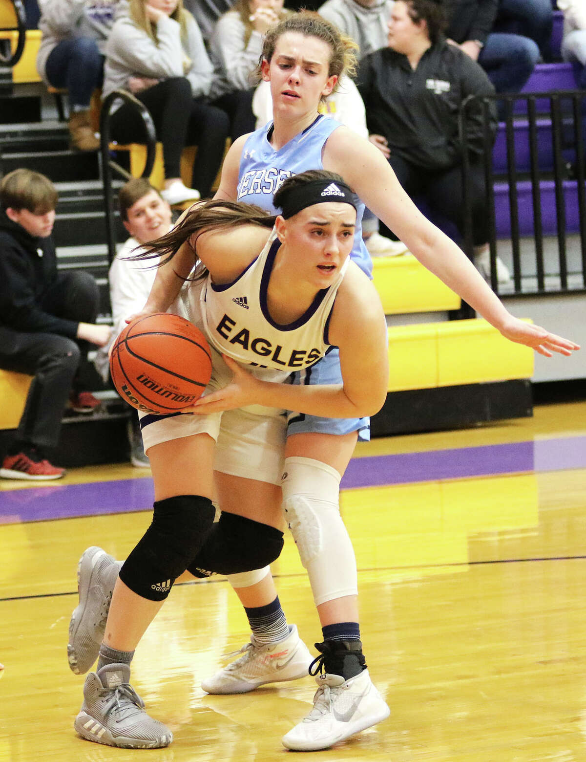 CM's Anna Hall (left) drives past Jersey's Chloe White in a game at Bethalto.
