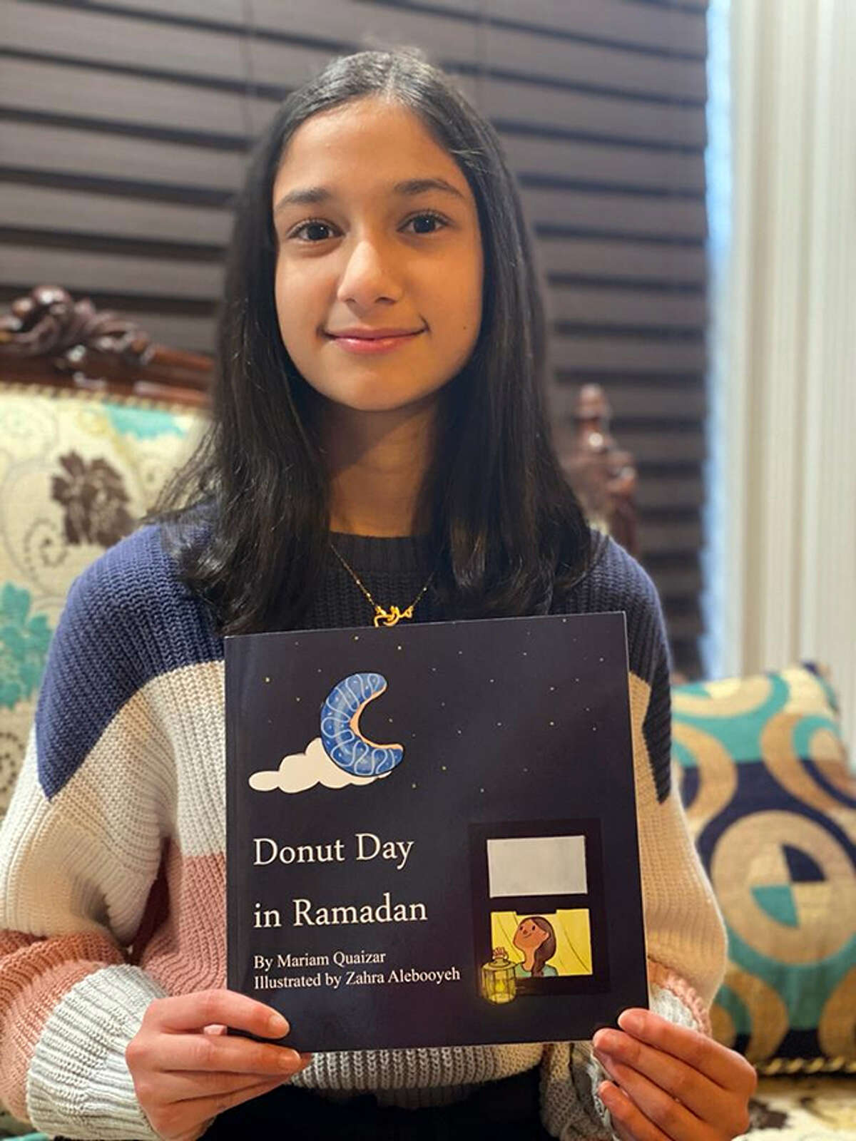 Mariam Quaizar, a freshman at Edwardsville High school, has just published a children's book, "Donut Day in Ramadan."