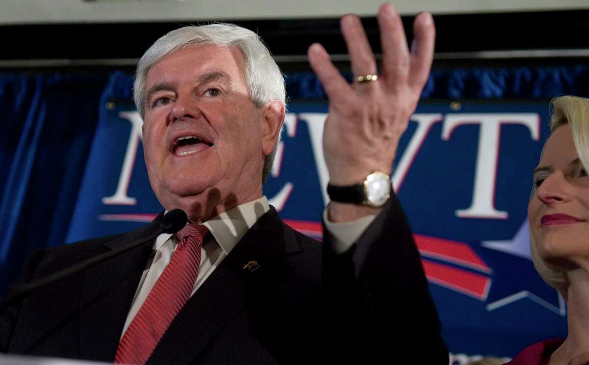 Newt Gingrich, the former House speaker from Georgia, celebrates his win in the South Carolina GOP presidential primary alongside his wife, Callista, in January 2012.