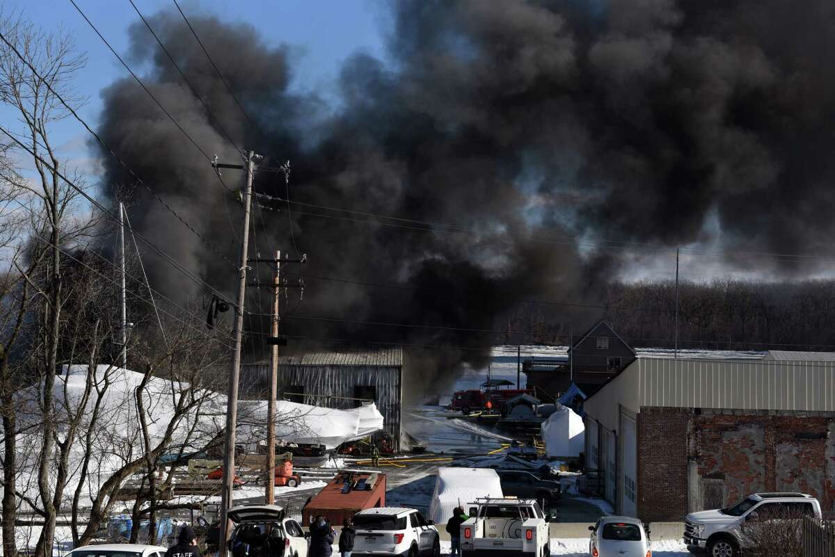 Fire consumes a repair shop at Coeymans Landing Marina on Thursday, Jan. 20, 2022, in Coeymans, N.Y. A badly burned worker was airlifted for treatment.