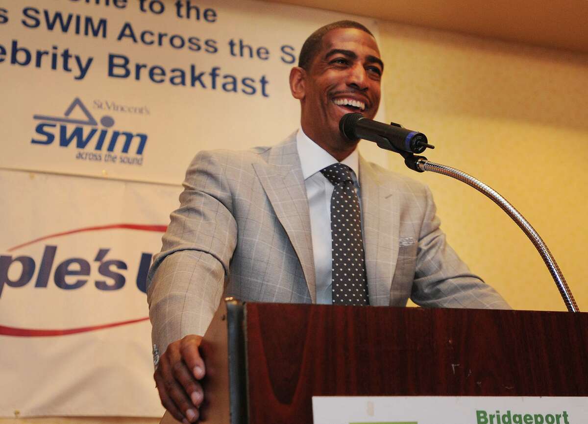 Then-UConn men’s basketball coach Kevin Ollie addresses the St. Vincent’s Swim Across the Sound benefit breakfast at the Holiday Inn in Bridgeport in 2015.