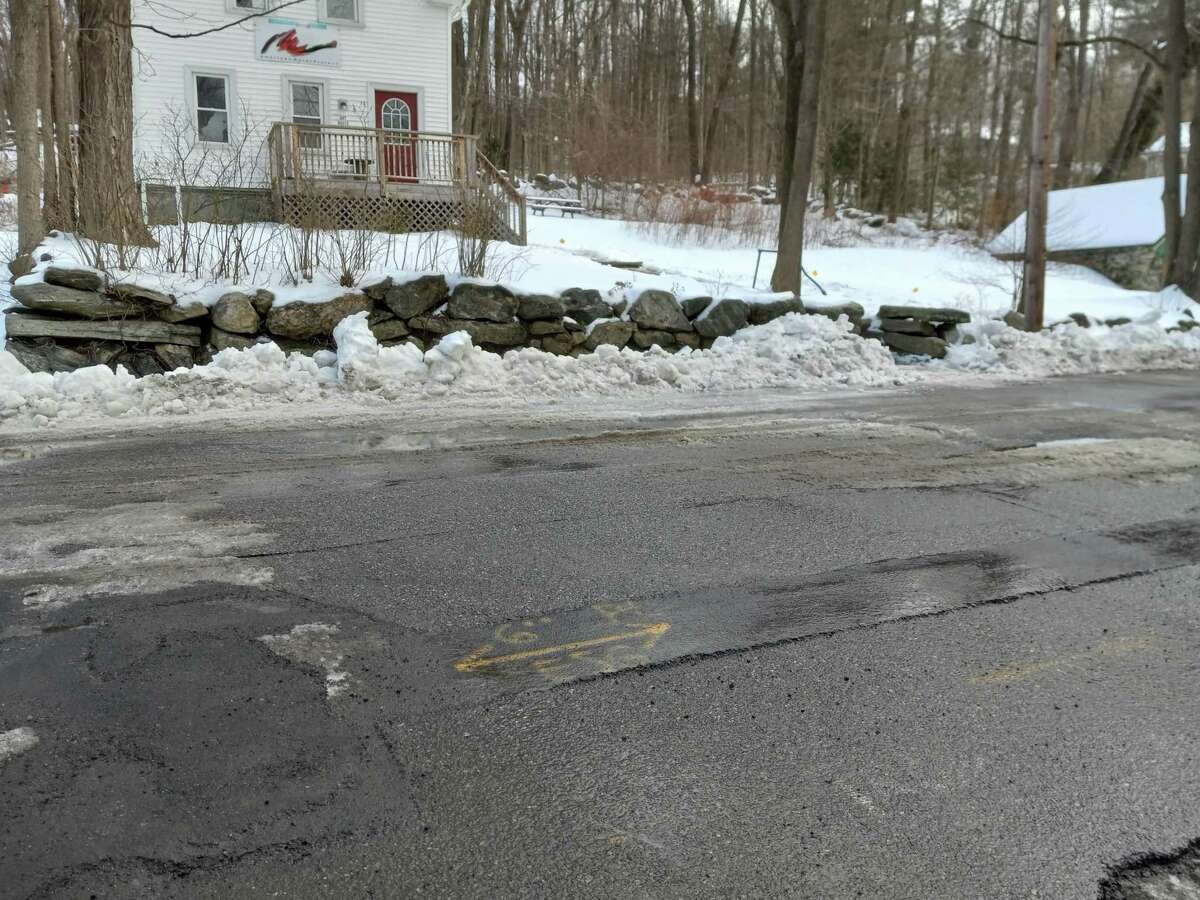 Winsted Town Manager Josh Kelly and Public Works Director Jim Rollins detailed a $15 million plan to repair some of the town's worst roads. Pictured is a section of roadway on Whiting Street.