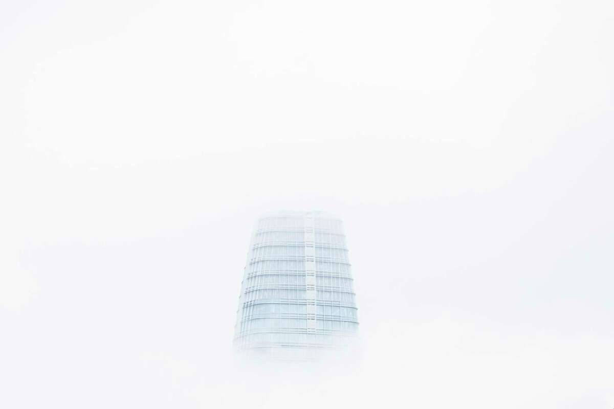 Salesforce Tower is seen through the fog from City Hall in San Francisco, California Tuesday, Jan. 4, 2022.