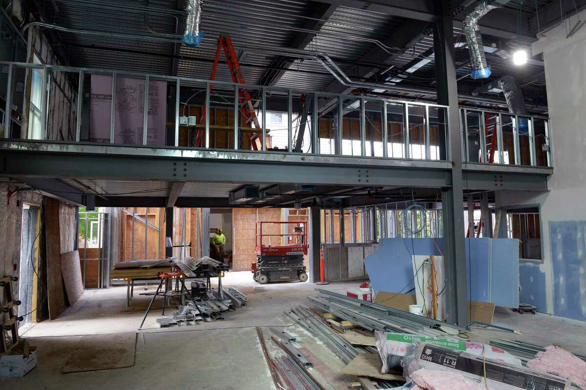 The expansion and renovation construction work continues on the New Milford Library. The mezzanine overlooking the new children's space. Friday, September 3, 2021, New Milford, Conn. The library’s reopening has been delayed to end of June.