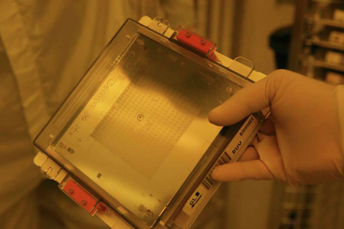 A cartridge with a master pattern is used in the production of computer chips at Tower Semiconductors in Westover Hills, Friday, Jan. 14, 2022. The company produces computer chips that are used in several industries including the automotive and smart phone production.