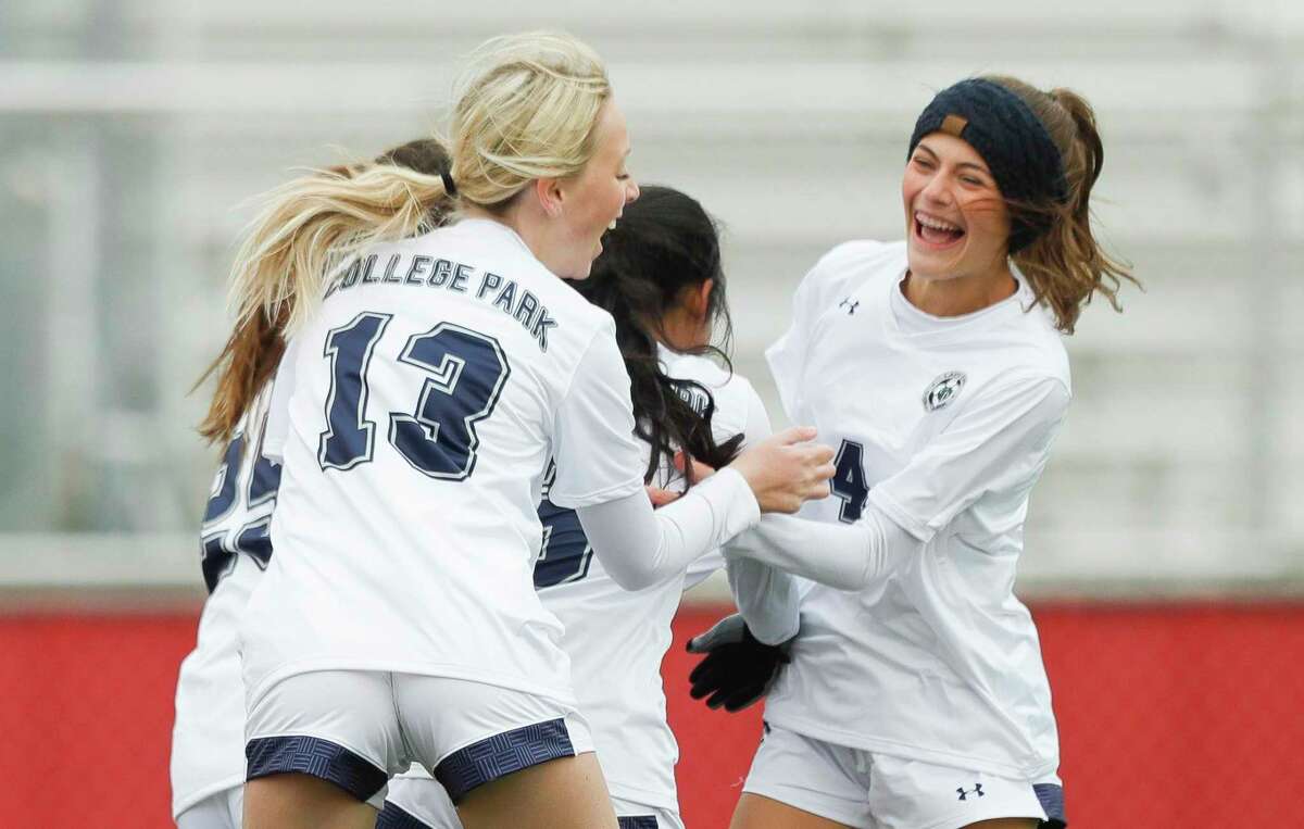 College Park’s Chloe Ramesai (4) celebrate after Simrah Gupta’s goal during the first period of a non-district high school soccer match, Thursday, Jan. 20, 2022, in Splendora.