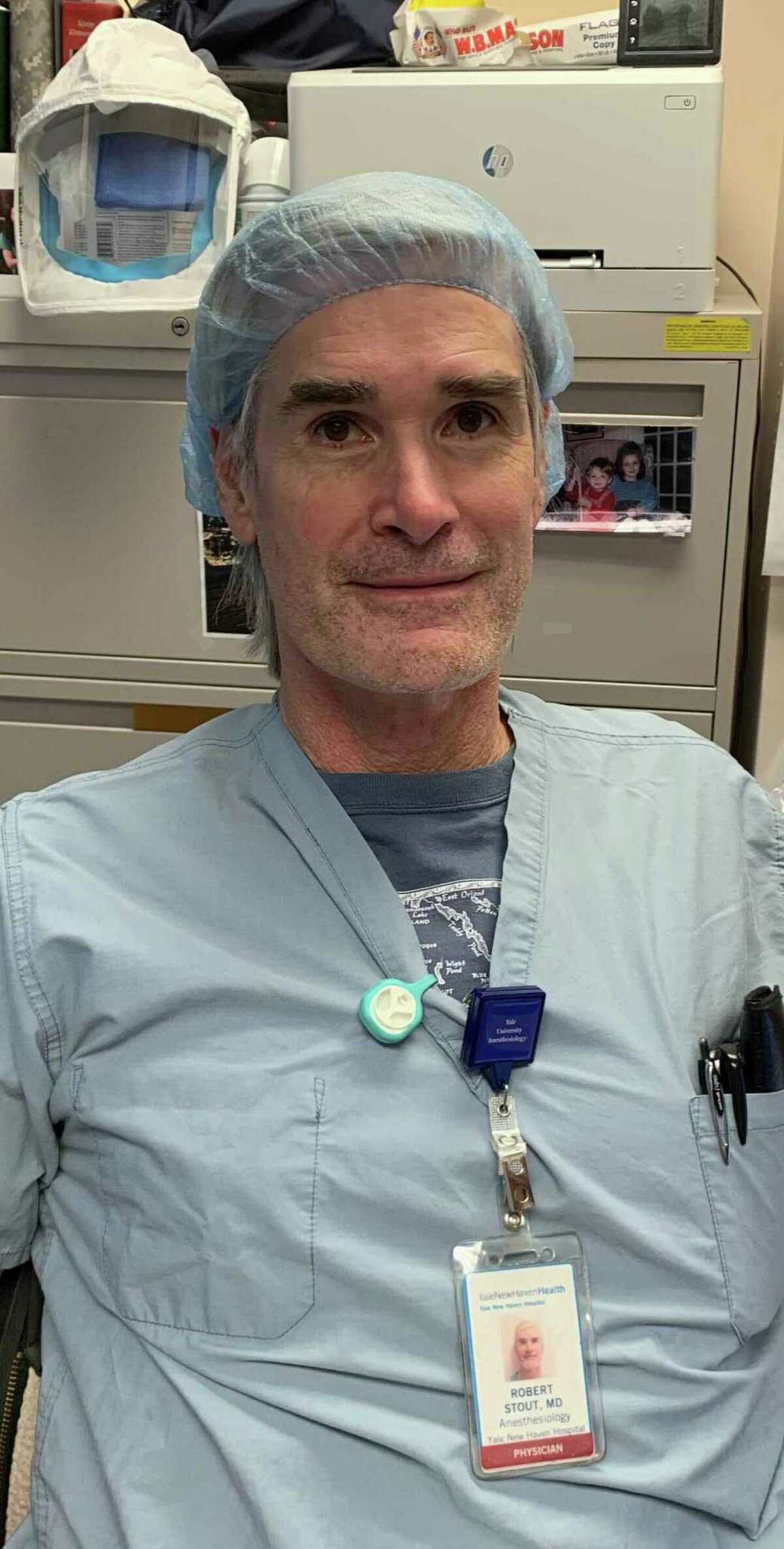 Dr. Bob Stout, a physician at Yale New Haven Hospital, wears a Fresh Air Clip designed by researchers at the Yale School of Public Health.