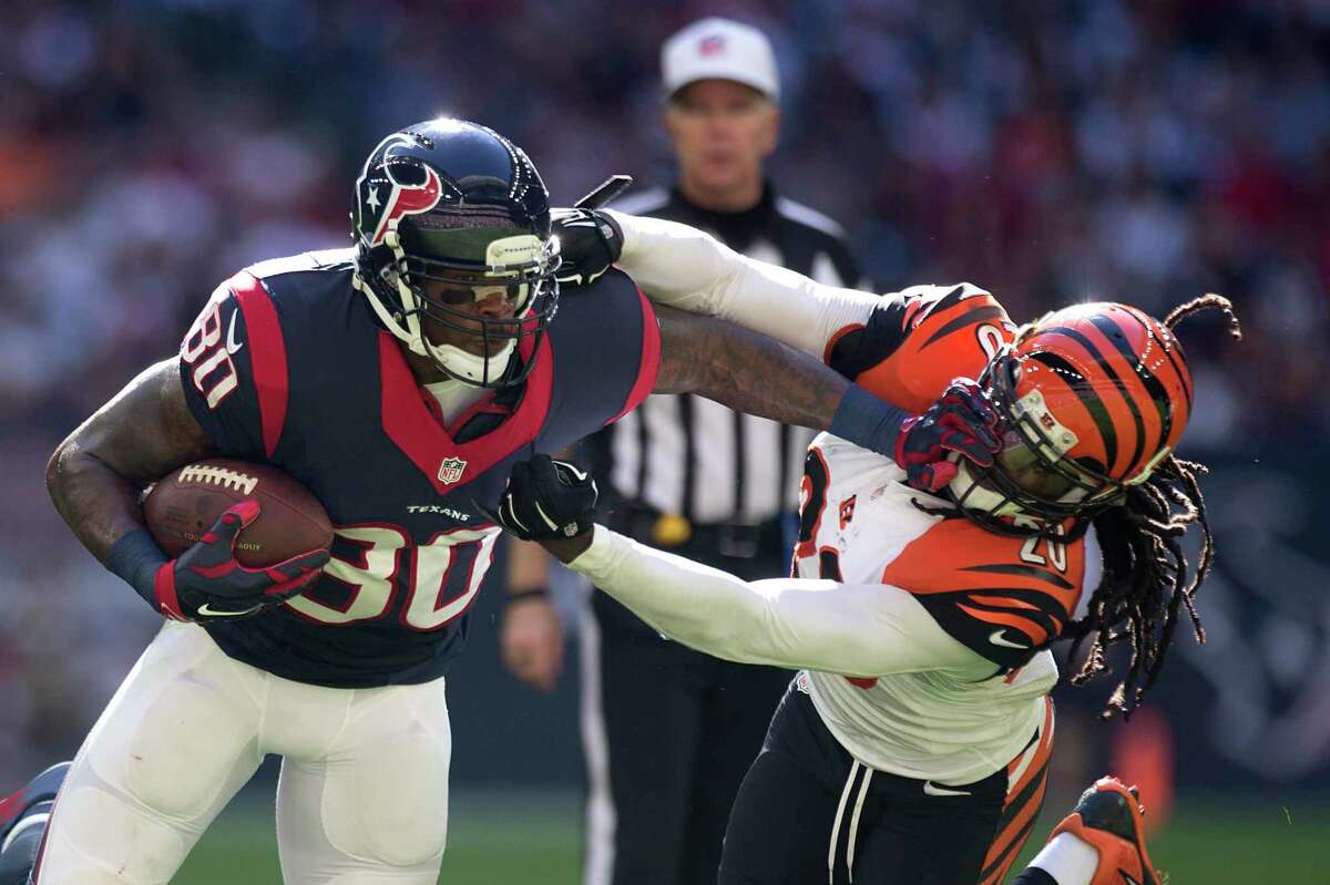 Houston Texans wide receiver Andre Johnson (80) tries to push his way around Cincinnati Bengals free safety Reggie Nelson (20) during the second quarter of an NFL football game at NRG Stadium on Sunday, Nov. 23, 2014, in Houston. ( Brett Coomer / Houston Chronicle )