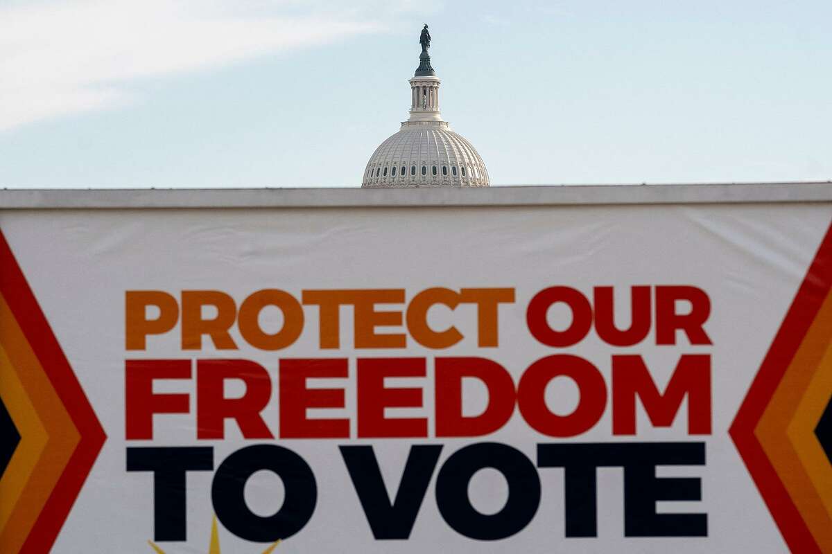 A vehicle displays a sign reading, “Protect Our Freedom To Vote,” in front of the U.S. Capitol in Washington, D.C., on Jan. 19, 2022. The U.S. Senate voted Wednesday on a voting rights bill.