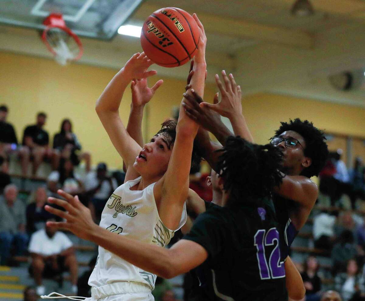 Conroe forward Nick Gergley (11) battles for a rebound during the second quarter of a non-district high school basketball game at Conroe High School, Tuesday, Oct. 16, 2021, in Conroe.