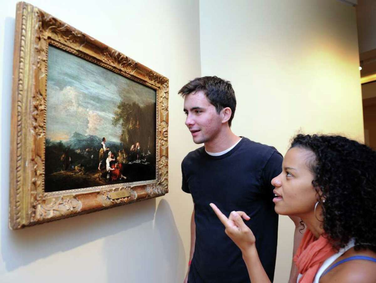 Fairfield University senior Sean Savage and junior Cicily Collazo examine a painting hung in the Frank and Clara Meditz Gallery Friday Sept. 24, 2010 at the new Bellarmine Museum of Art, set to open in October.
