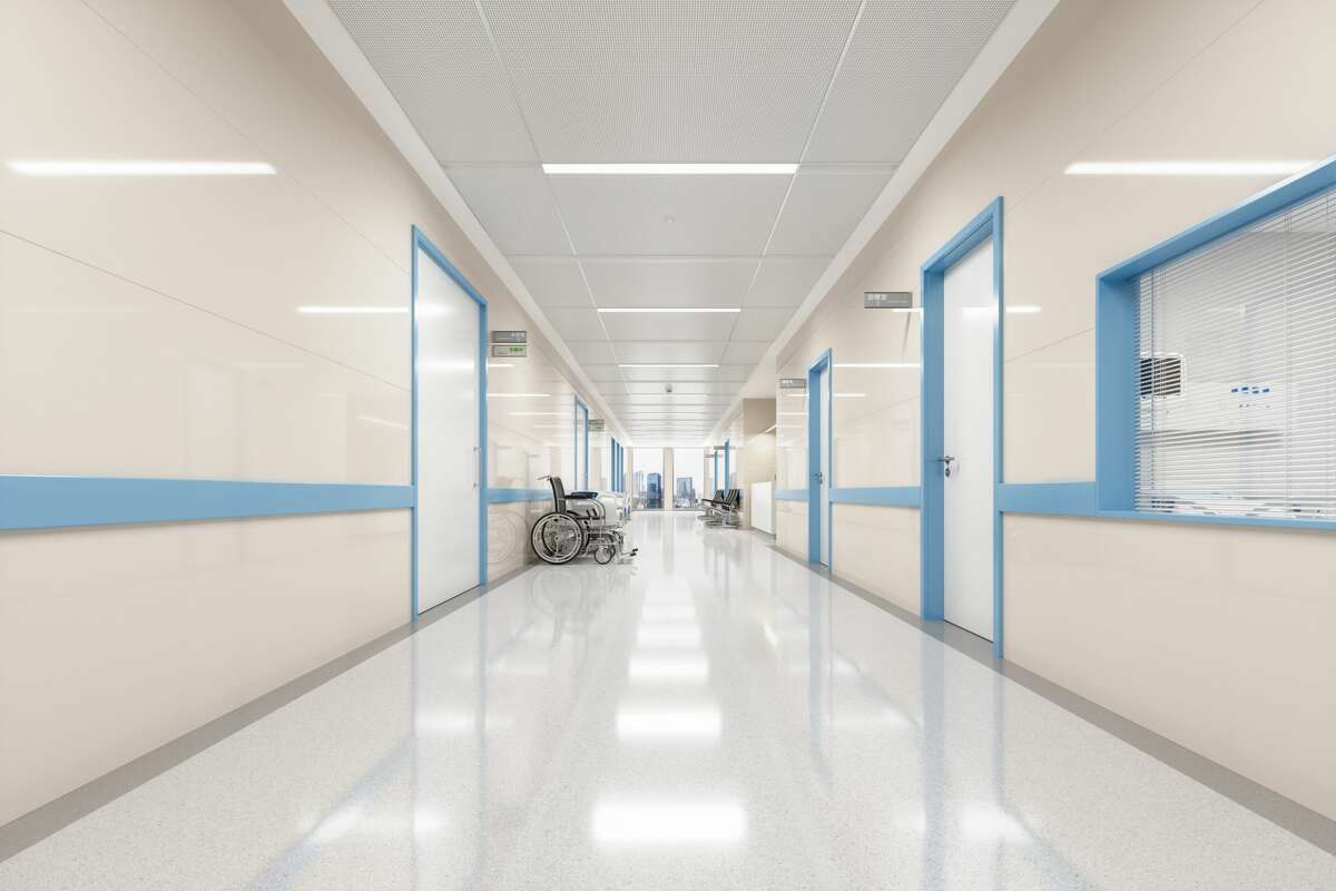 FILE — A corridor of an empty modern hospital. 
