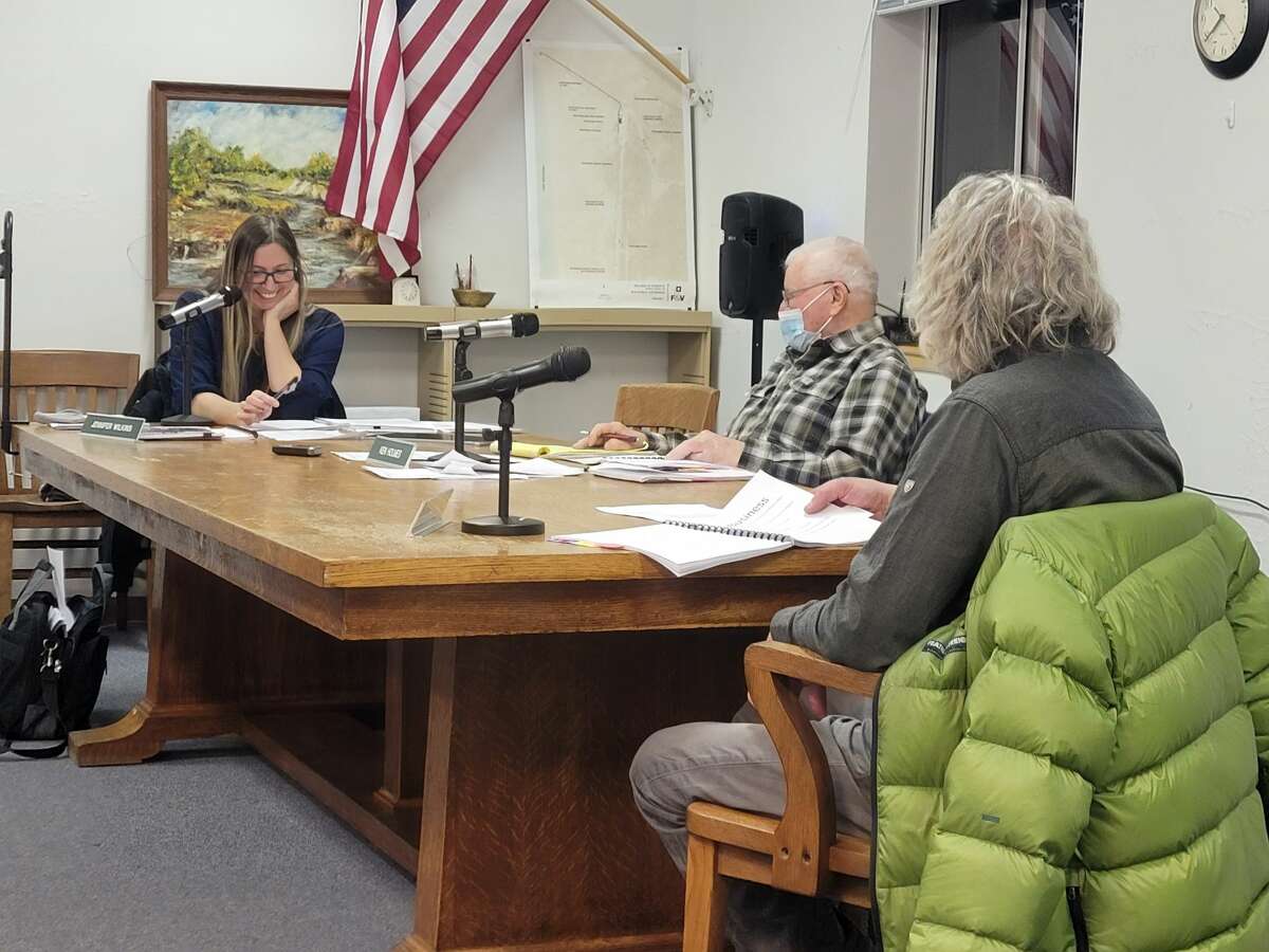 Elberta Village Council members Jennifer Wilkins, Ken Holmes and Bill Soper approve a zoning ordinance on Jan. 20 that will allow the village to ask developers to cover the costs of professional services required to study site plan applications. 