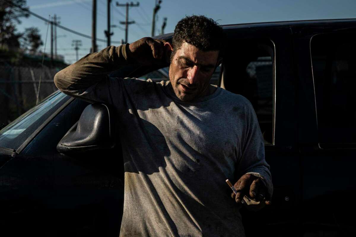 Daniel Ghilarducci, who collects scrap metals for a living, is seen outside a City-run RV site on Carroll Avenue in San Francisco, California Wednesday, Jan. 19, 2022. Ghilarducci, who has been on the streets for 15 years and is an expectant father, was moved to the Carroll site along with other residents who were temporarily living out of their vehicles parked along Hunters Point Expressway while the City prepared a more permanent site at the nearby Candlestick Point State Recreation Area.