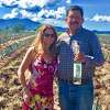 Lisa Elovich stands in the agave field with her master distiller Eladio Montes, whose family owns the farm.