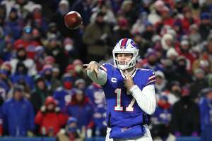 BUFFALO, NEW YORK - JANUARY 15: Josh Allen #17 of the Buffalo Bills throws a pass against the New England Patriots during the second quarter in the AFC Wild Card playoff game at Highmark Stadium on January 15, 2022 in Buffalo, New York. (Photo by Timothy T Ludwig/Getty Images)