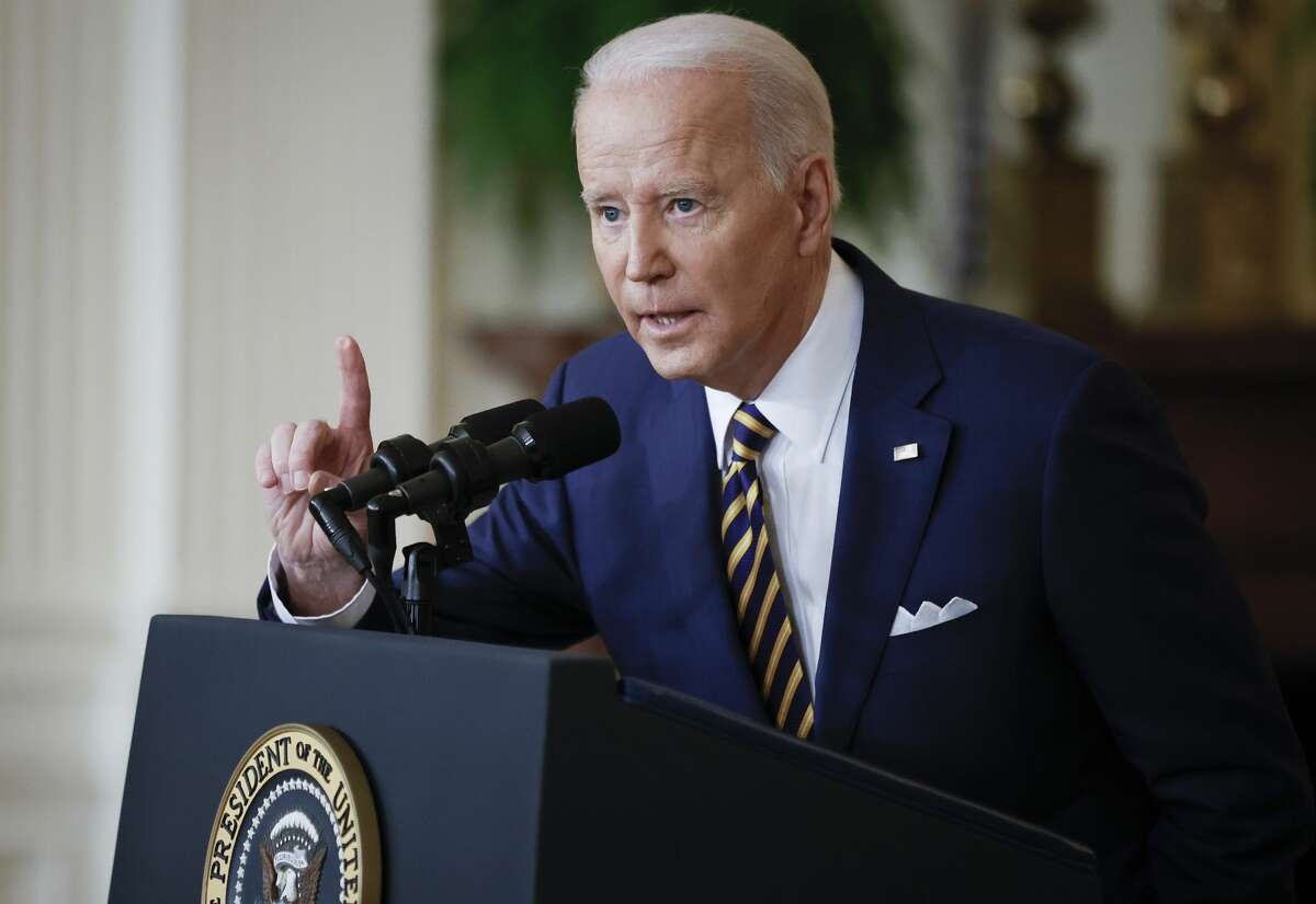 President Joe Biden answers questions during a news conference in the East Room of the White House.