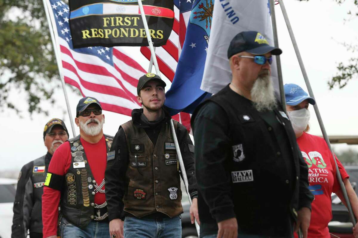 Members of the Texas Patriot Guard Riders bring the service flags at the start of the service.
