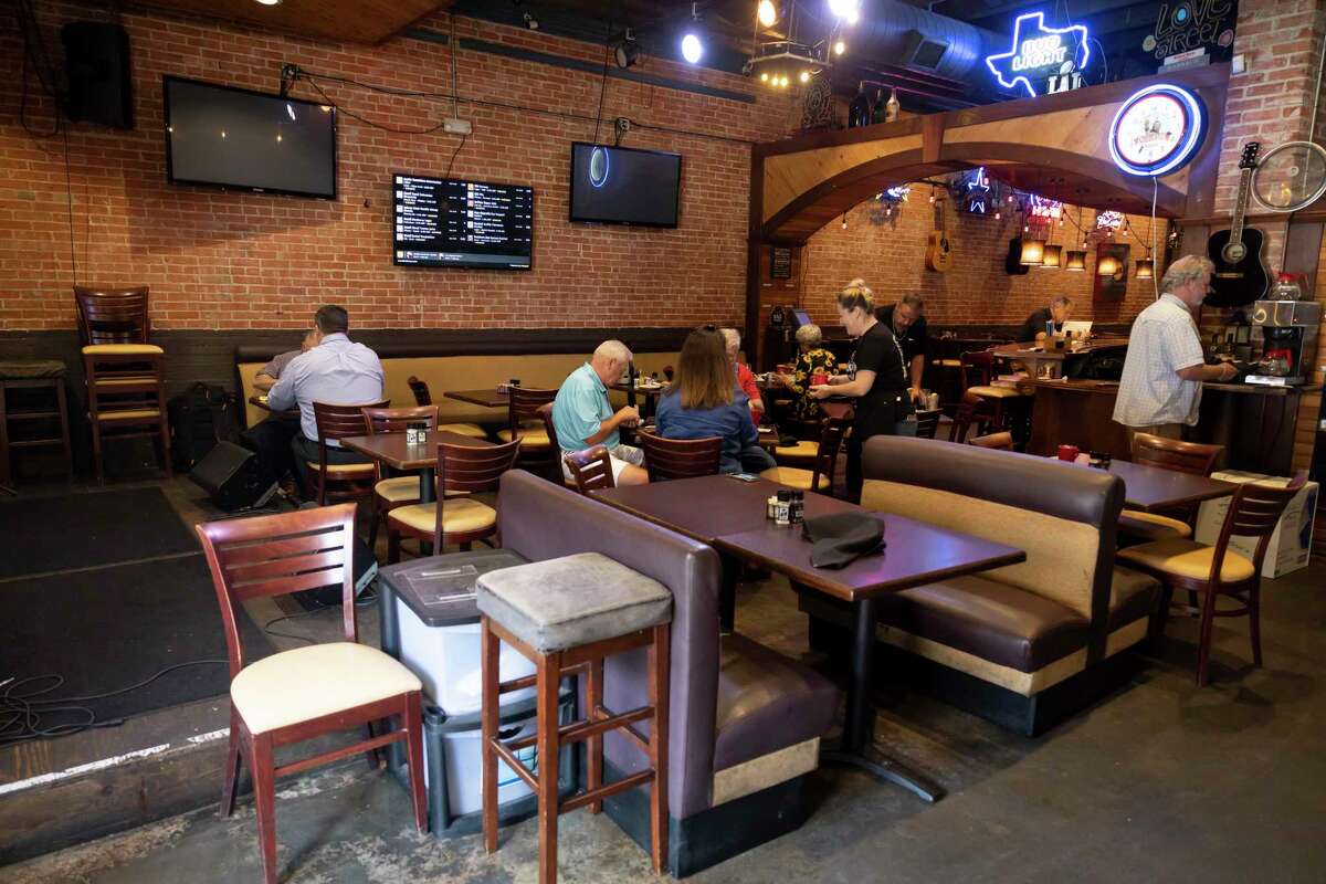 Patrons are seen at the Red Brick Tavern, Tuesday, June 8, 2021, in downtown Conroe. The owner Debbie Glenn is now the president of the Montgomery County Restaurant Association.