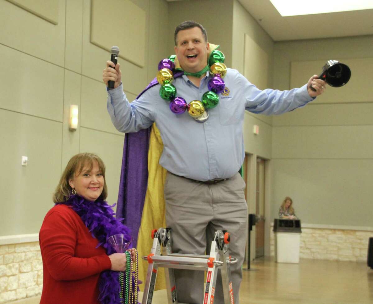 At the Conroe Noon Lions Club last week, 1st VP Warner Phelps (r) was on his ‘high horse’ or rather ‘high ladder’ to get the attention of the club members about the Dinner/Dance & Auction coming up in February and the need for auction items; also pictured Auction Chair Pauline Veazey (l).