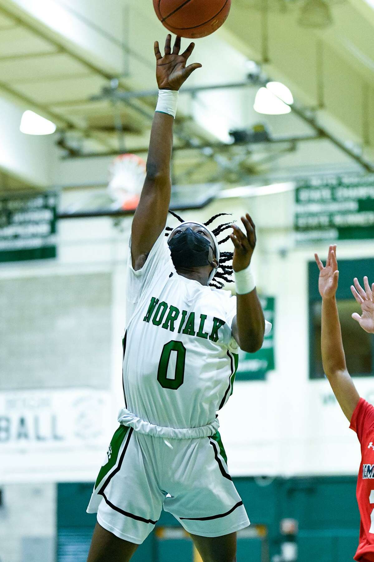 Norwalk’s Terrell Holley goes up for a shot during a recent game at Norwalk High.