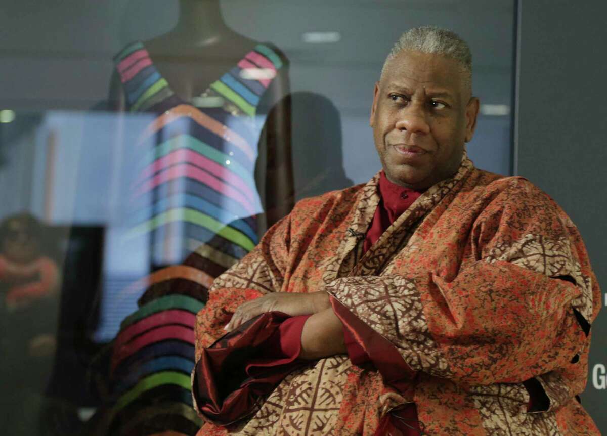 André Leon Talley, a former editor at large for Vogue magazine, speaks to a reporter at the opening of the "Black Fashion Designers" exhibit at the Fashion Institute of Technology in New York, Tuesday, Dec. 6, 2016. Talley, the towering former creative director and editor at large of Vogue magazine, has died.