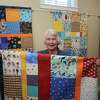Sturges Ridge of Fairfield resident Cecily Zerega poses with some of her quilts in Fairfield on Jan. 19.