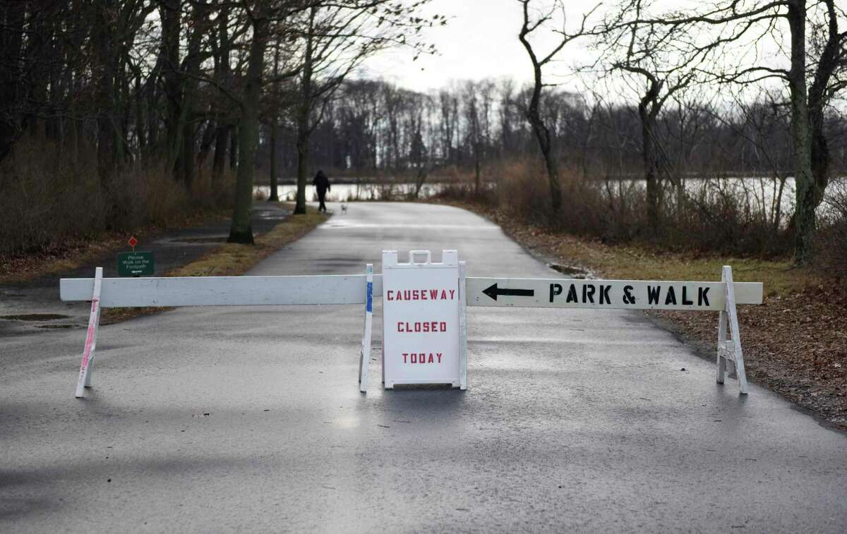 A sign indicates that the causeway is closed at Greenwich Point Park in Greenwich, Conn. Thursday, Jan. 20, 2022. Until April, the park loop will be closed to vehicular traffic past the beach parking lot. The roads will remain open to pedestrians and cyclists, other than the causeway itself.