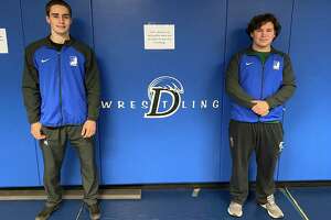 Darien's 2021-22 wrestling co-captains Mason Hedley (left) and Rhys Overbeck.