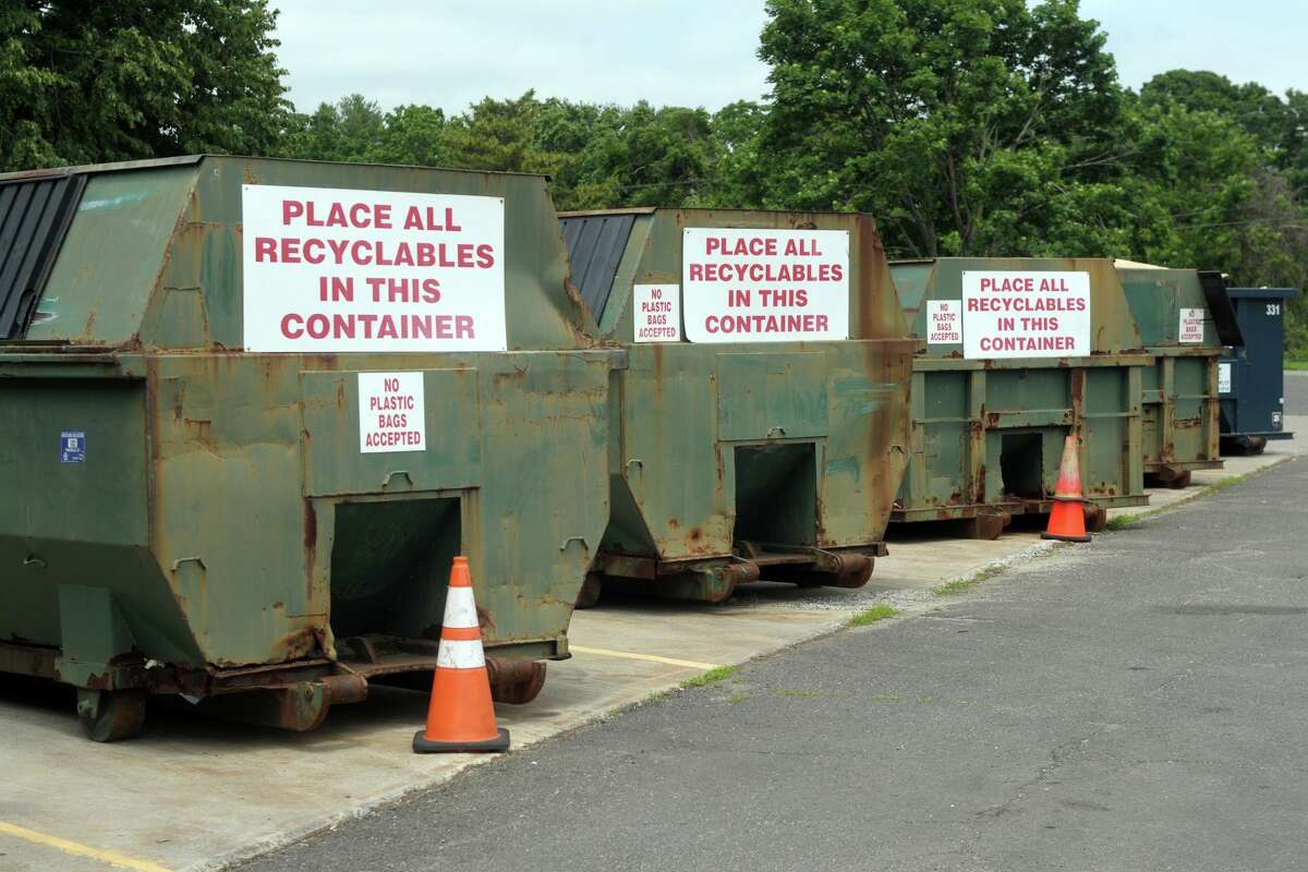 Dumpsters where residents can dump their recycling items at the town’s transfer station, in Fairfield, Conn. June 25, 2021.