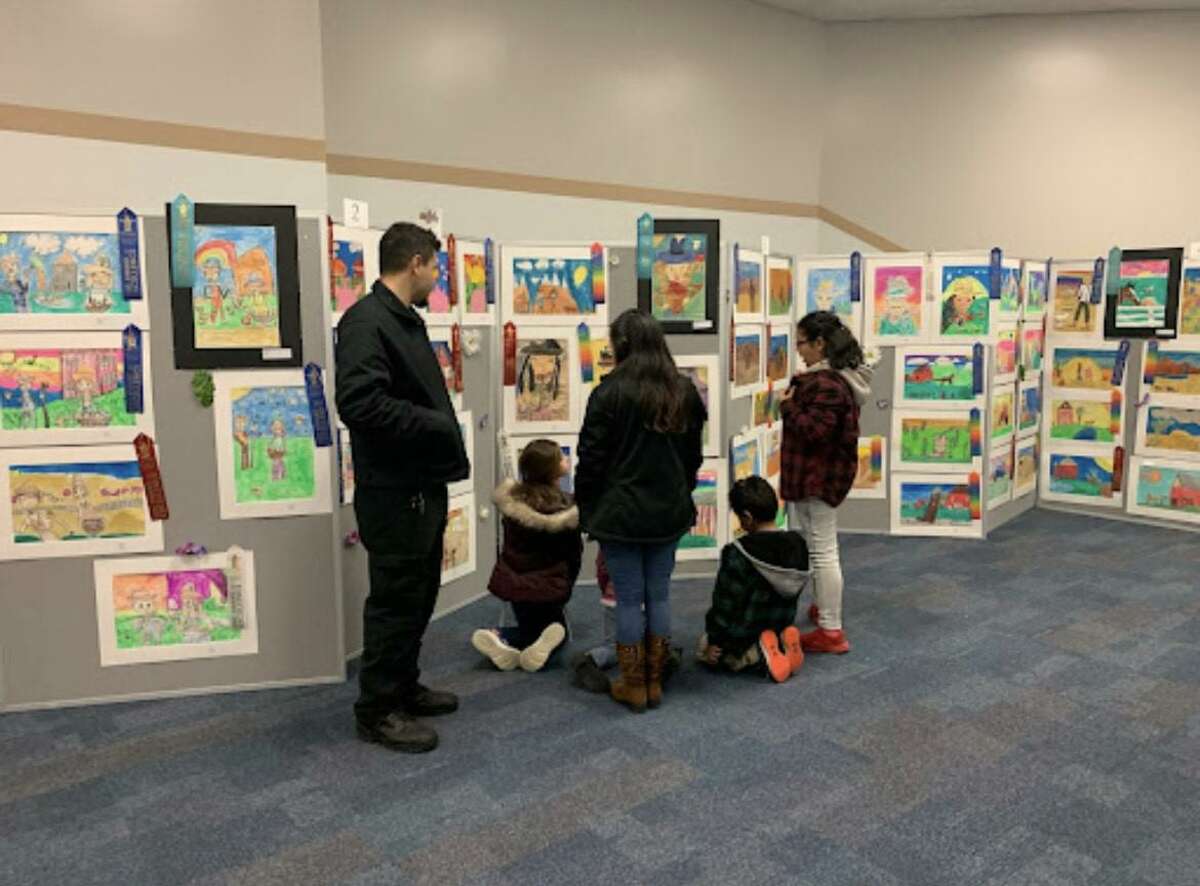 Family members tour the exhibit with their children who helped produce the winning western art. For those who missed the exhibit, works can also be viewed on the Huffman Visual Arts Facebook page.