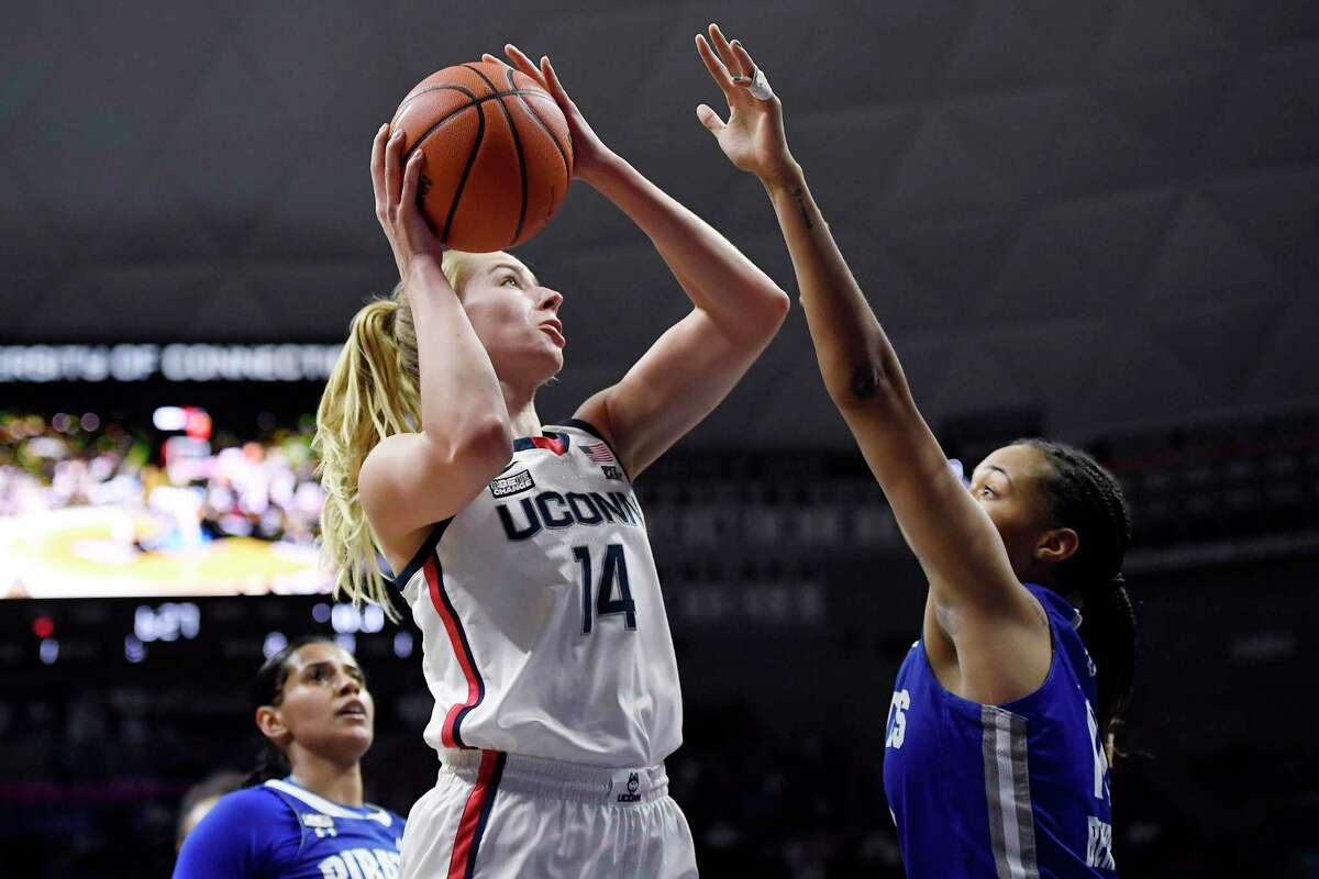 UConn’s Dorka Juhász, left, goes up for a basket against Seton Hall’s Mya Bembry in the first half of Friday’s game in Storrs.