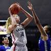 Connecticut's Dorka Juhász goes up for a basket against Seton Hall's Mya Bembry in the first half of an NCAA college basketball game, Friday, Jan. 21, 2022, in Storrs, Conn. (AP Photo/Jessica Hill)
