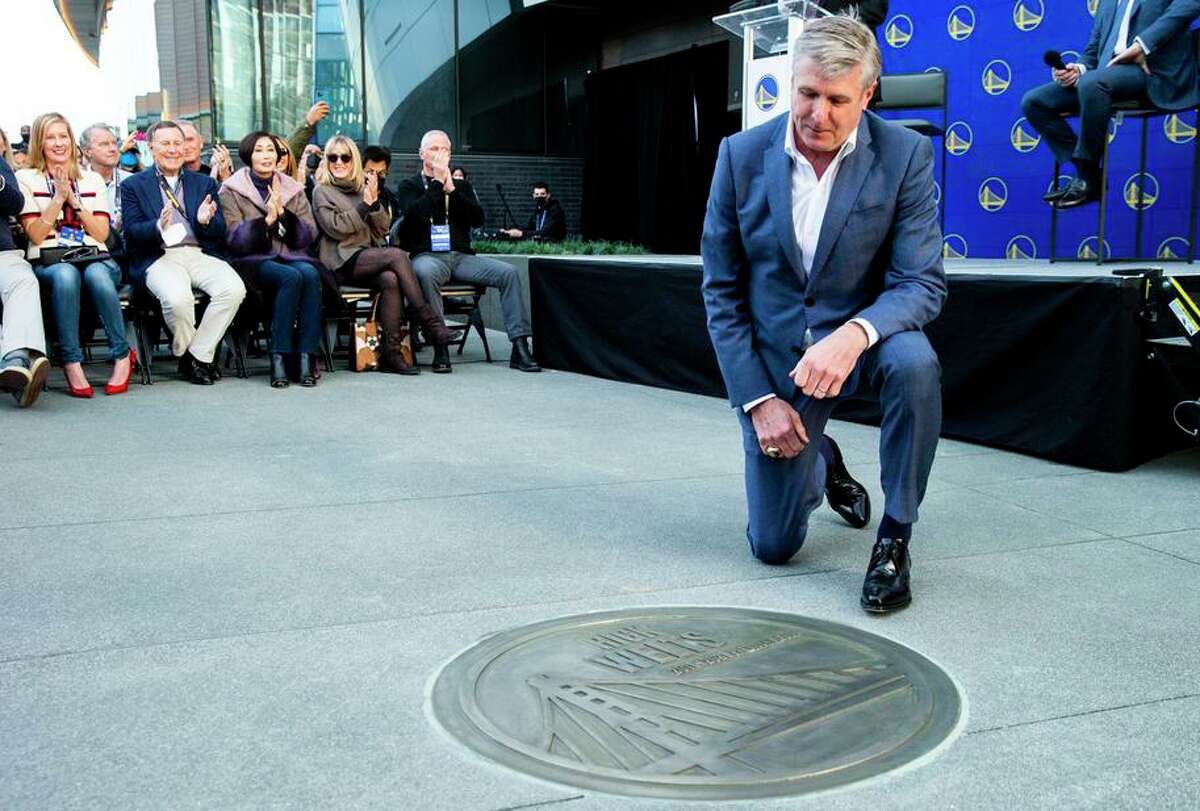 Rick Welts is emotional as he sees his commemorative medallion at the Warriors Walk of Fame at Chase Center.