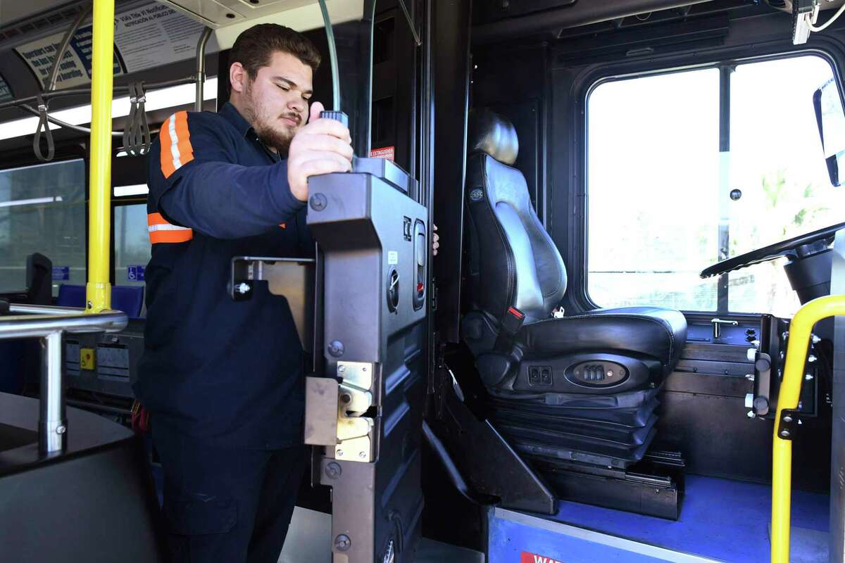 VIA bus shop attendant Joseph Uriegas checks a new driver cabin door of the type installed on six buses as part of a pilot program to provide protection to bus drivers on Feb. 27, 2020. Metropolitan Transit Authority is planning to install dividers on all Houston area buses.