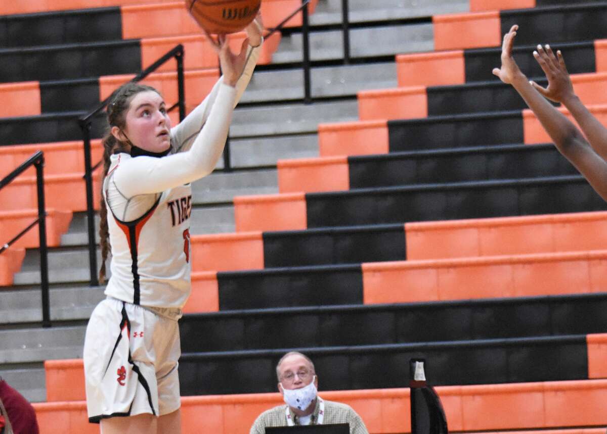 Edwardsville's Elle Evans hits a 3-pointer against Whitfield during the second half on Friday inside Lucco-Jackson Gymnasium in Edwardsville.