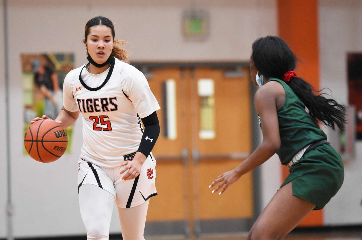 Edwardsville's Sydney Harris brings the ball up the court against Whitfield during the second half on Friday inside Lucco-Jackson Gymnasium in Edwardsville.