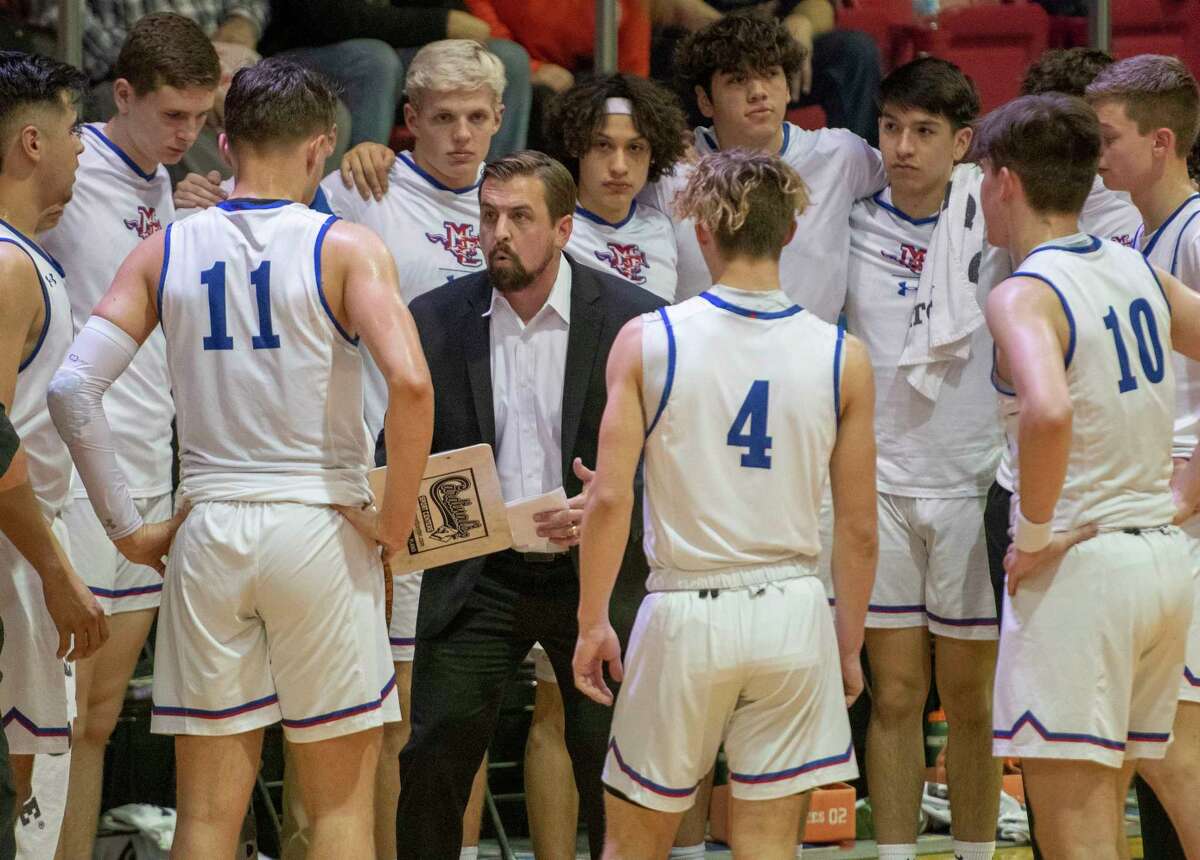 Midland Christian head coach Chris Ryburn talks with his players during a timeout against Argyle Liberty 01/21/2022 at the McGraw Event Center. Tim Fischer/Reporter-Telegram