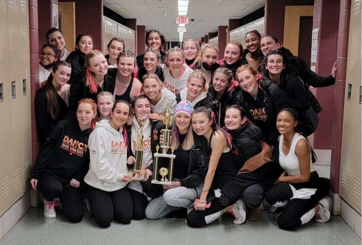 The Ridgefield High Dance Team with their first place trophies won at the Woodland Regional Dance Competition. Coach Taylor Jane Bobay is in the front row with the hat on.
