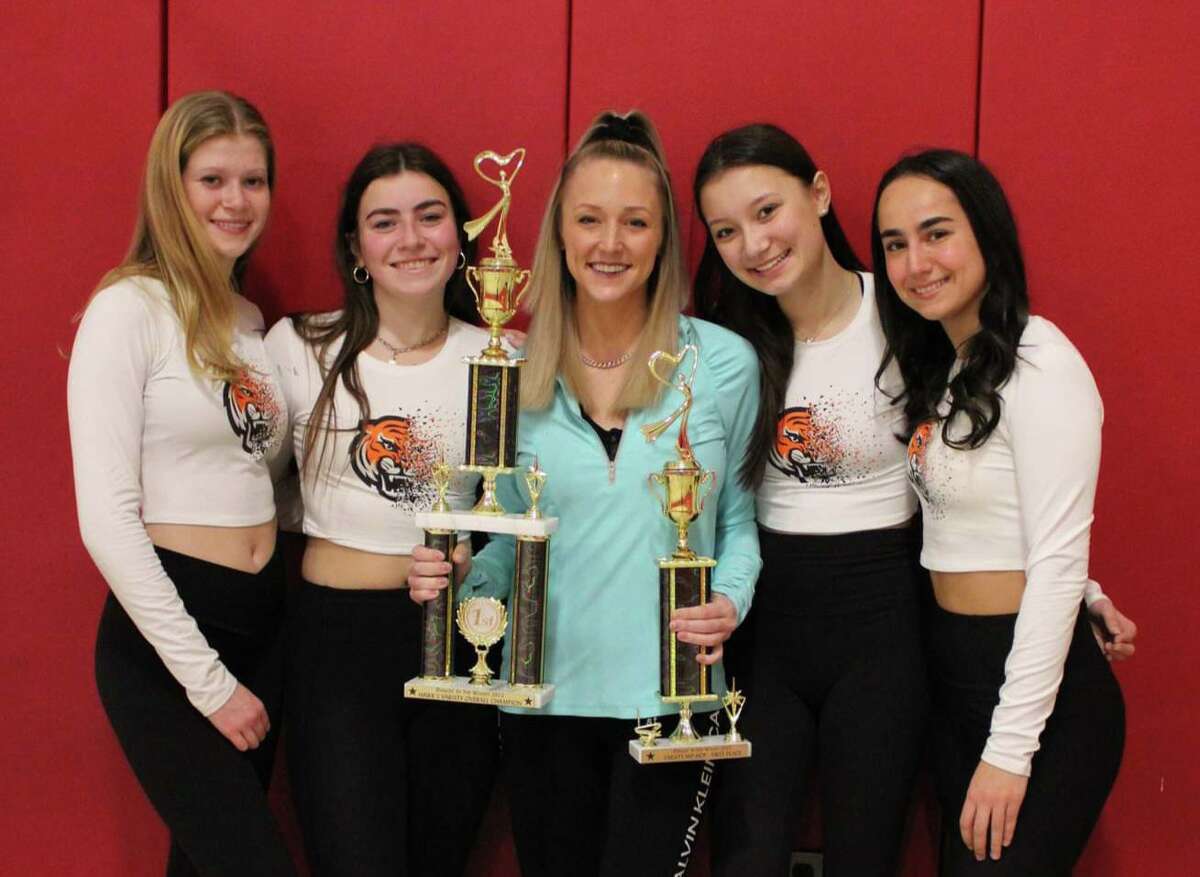 Ridgefield High Dance Team captains with coach Taylor Jane Bobay holding their first place trophies from the Woodland Regional Competition. L-R, Eliza Morris, Claire Wilkinson, coach Bobay, Hailey DeWalt and Lauren Toia.