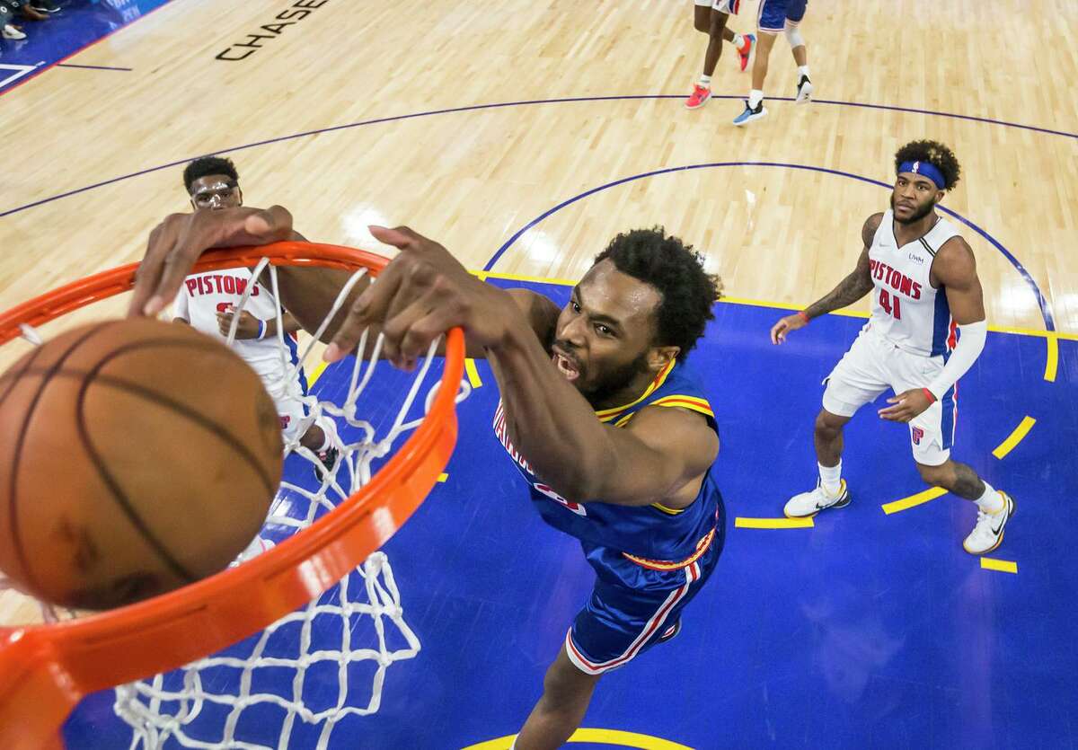 Andrew Wiggins (22) dunks in the first half as the Golden State Warriors played the Detroit Pistons at Chase Center in San Francisco, Calif., on Tuesday, January 18, 2022.