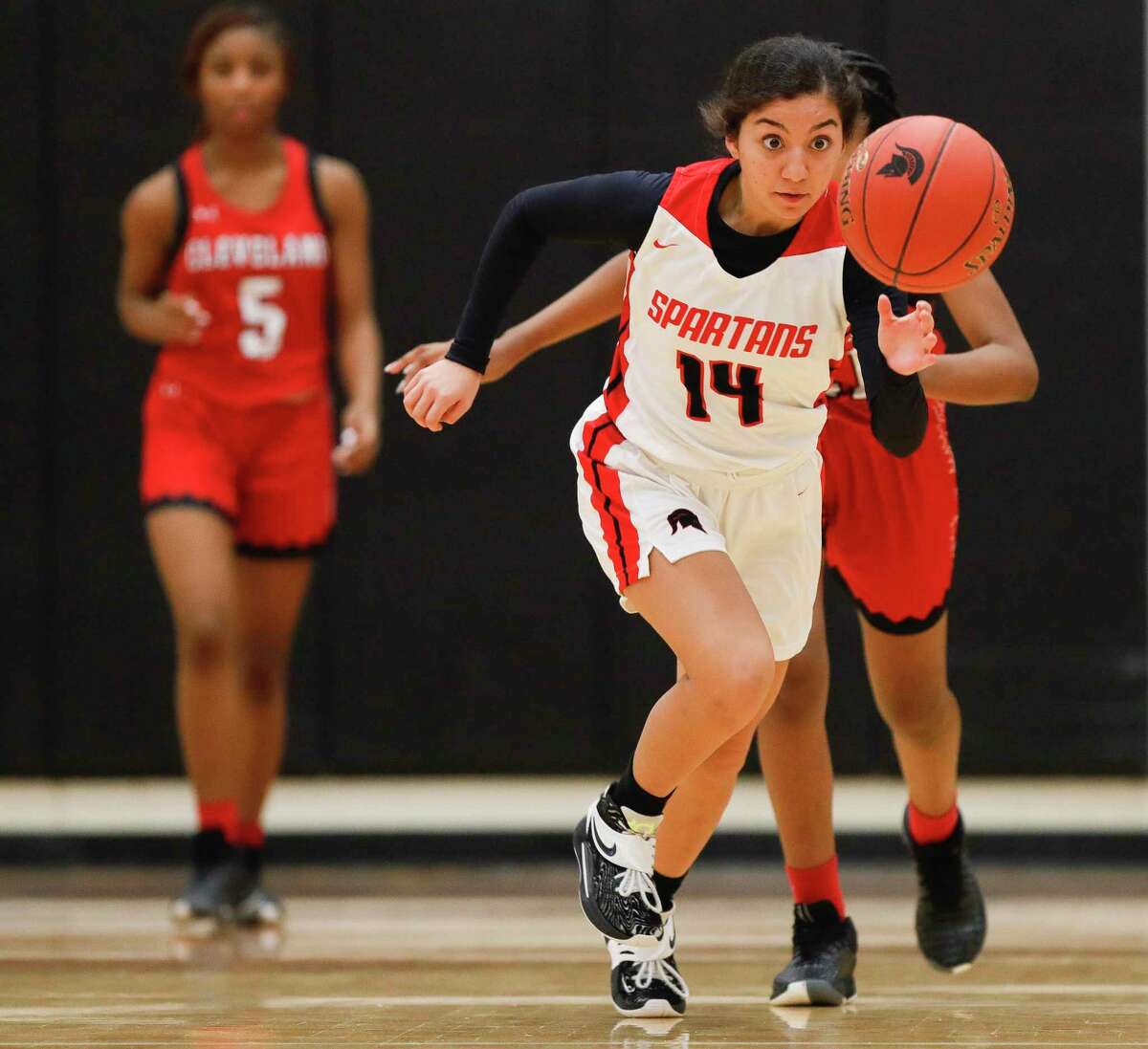 Porter point guard Isabella Busto (14) chases down a loose ball in the second quarter of a high school basketball game at Porter High School, Friday, Jan. 21, 2022, in Porter.