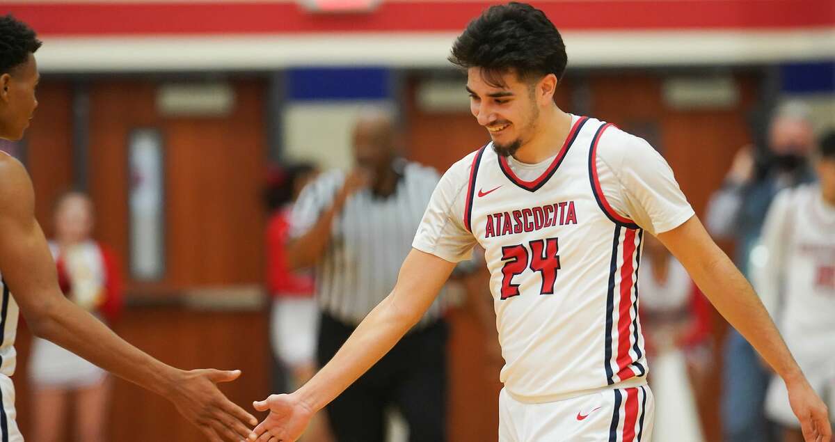 Atascocita guard David Martinez (24) celebrates scoring in the fourth quarter against Kingwood during District 21-6A boys basketball game action in Humble on Friday, Jan. 21, 2022. Atascocita won the game 45-41.