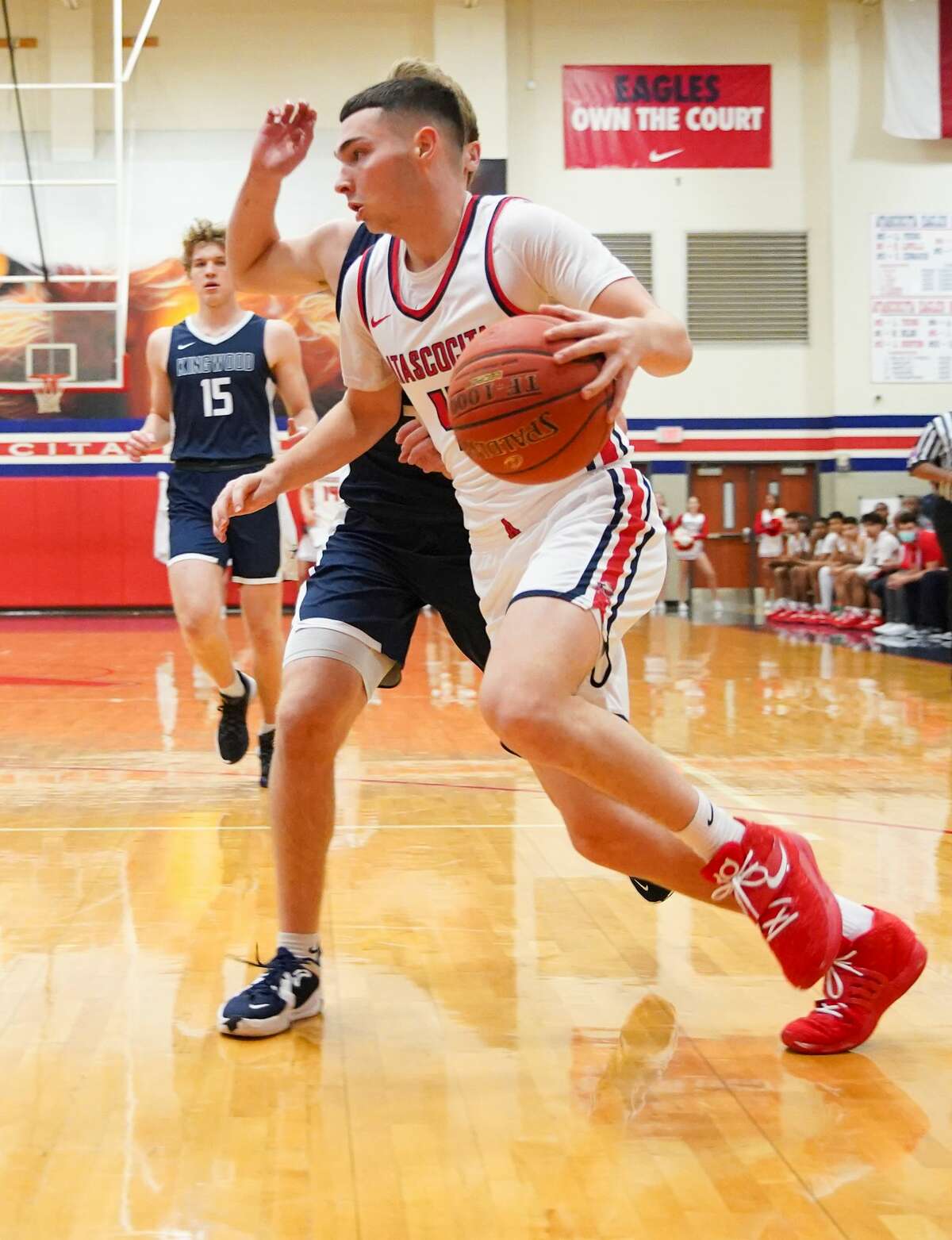 Atascocita guard A.J. Aungst (4) drives to the basket during District 21-6A boys basketball game against Kingwood in Humble on Friday, Jan. 21, 2022. Atascocita won the game 45-41.