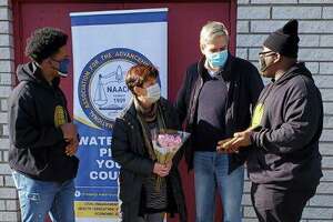 Amy and Bob Stefanowski, at center, received an award from the Waterbury NAACP Youth Corps on Sept. 9, 2021, for their volunteer work buying and distributing masks in the spring of 2020.