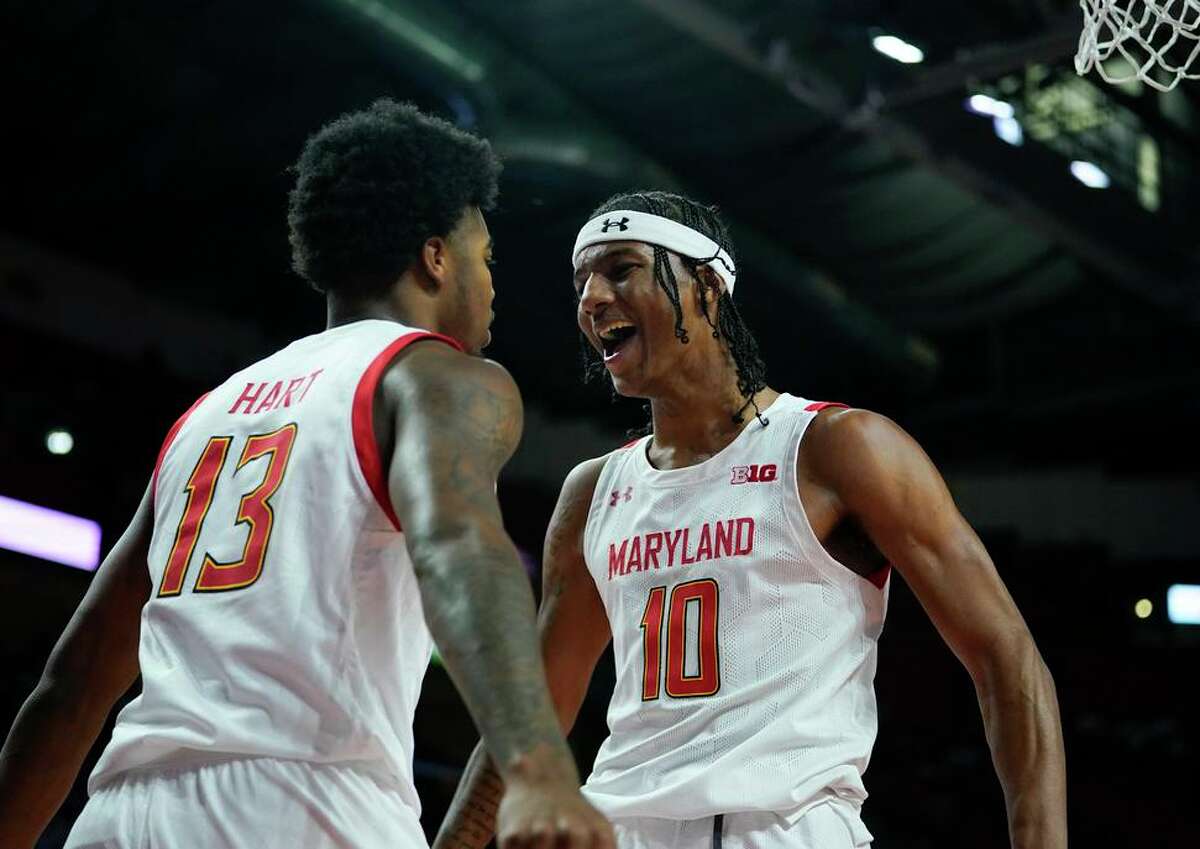 Maryland guard Hakim Hart and forward Julian Reese exult after a basket against Illinois in the second half in College Park, Md.