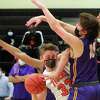 Ridgefield's Dylan Veillette (33) gets pressure from a Westhill's Greyson Miller (10) during FCIAC championship boys basketball game action in Ridgefield, Conn., on Friday March 27, 2021.