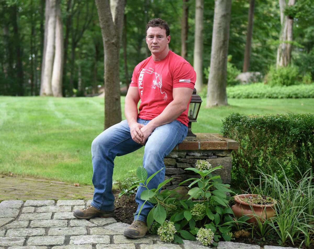 Former Navy SEAL and Trump political operative Carl Higbie poses outside his home in the Cos Cob section of Greenwich, Conn., Thursday, Sept. 5, 2019.