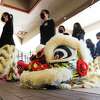 Members of the Houston Lion Kings set up for a dragon dance in celebration of the Lunar New Year at The Woodlands Children's Museum on Saturday in The Woodlands.