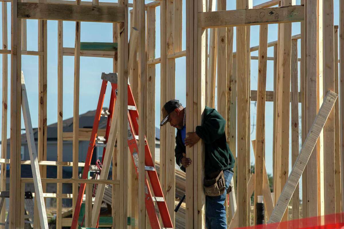 Crews work on new homes under construction in Converse in January.